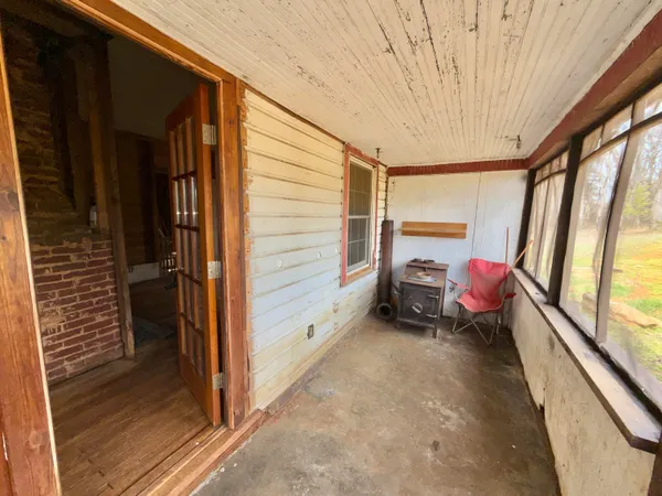 a view of a porch with a hardwood