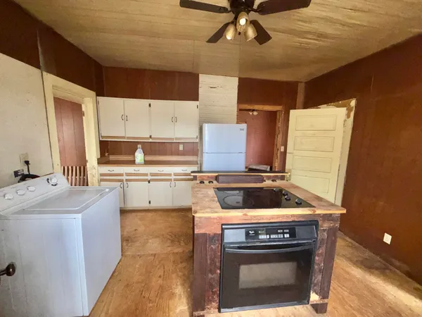 a kitchen with a stove and a microwave