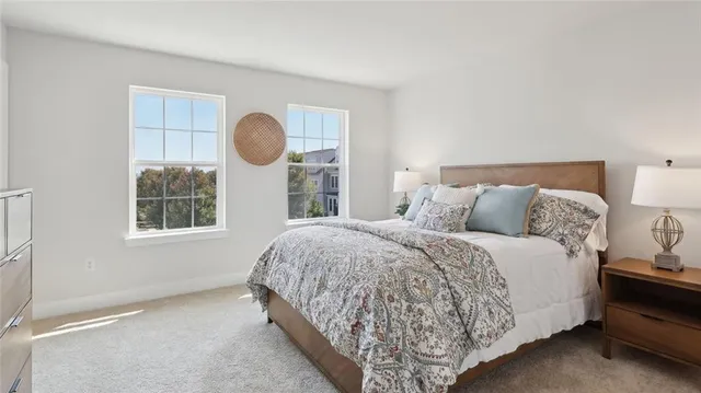 a bedroom with a bed and window