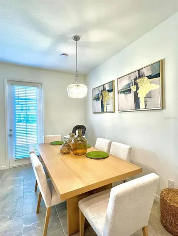 a kitchen with stainless steel appliances kitchen island granite countertop a sink and a stove
