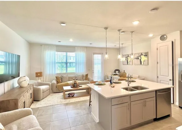 a room with a couch and a view of living room