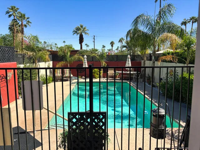 a swimming pool with patio outdoor seating and yard