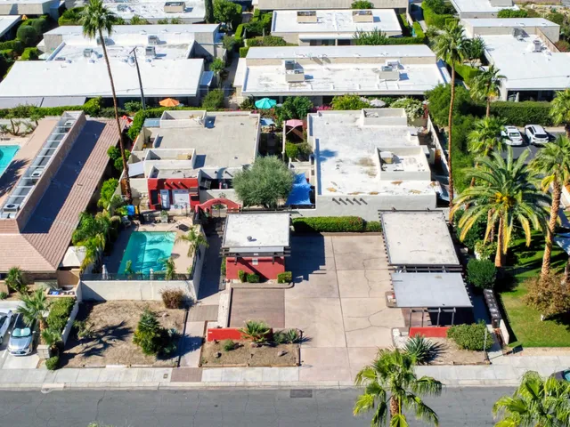 an aerial view of multiple houses with outdoor space