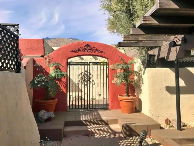 a view of a kitchen with a sink and windows