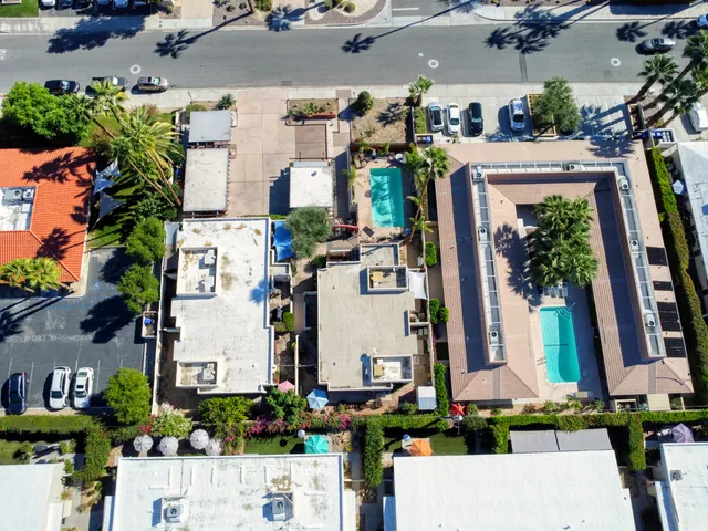an aerial view of residential houses with outdoor space
