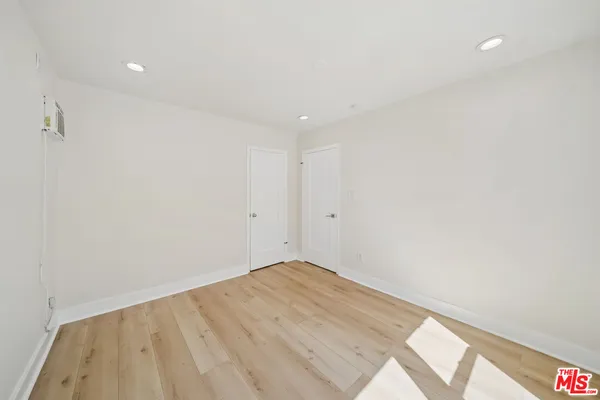 a bathroom with a sink toilet vanity and tub