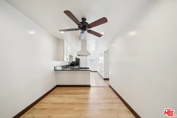 a kitchen with lots of appliances