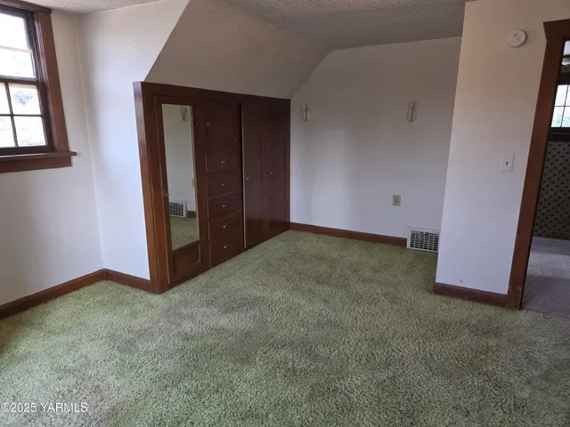 an empty room with closet