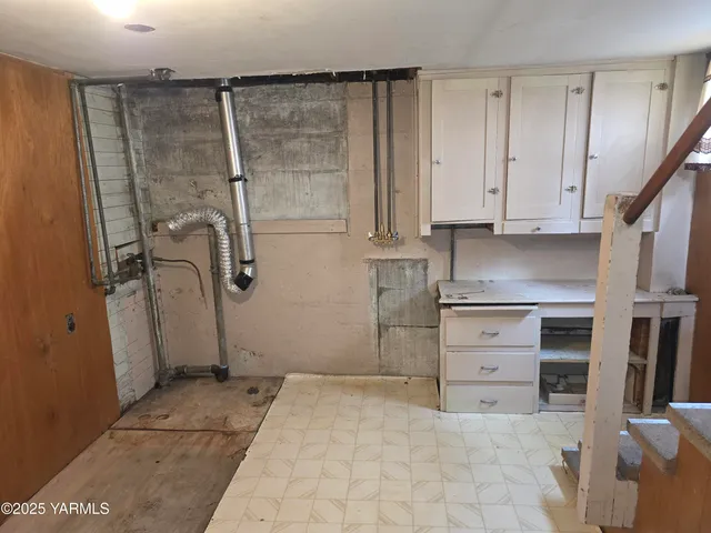 a bathroom with a toilet and a mirror