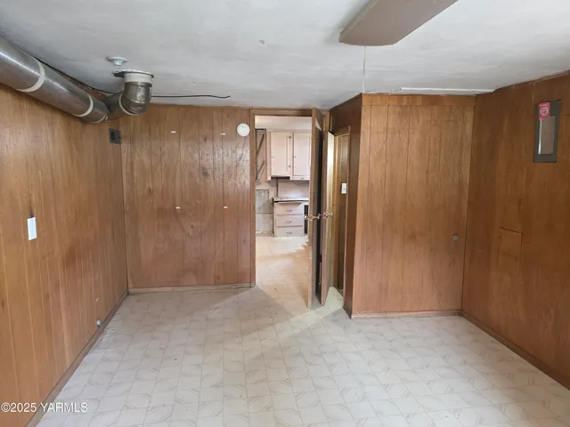 a view of entryway with wooden floor and door