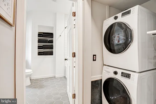 a view of a hallway with washer and dryer