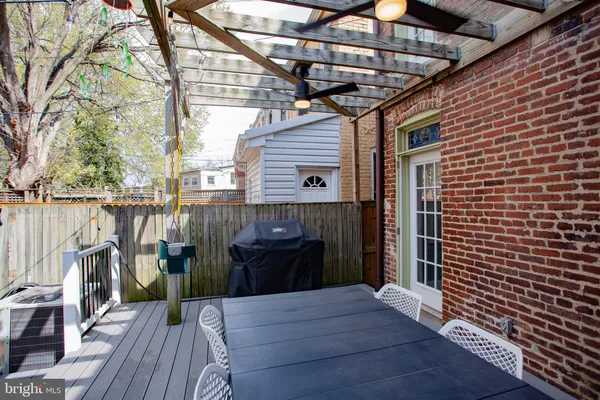 a view of a balcony with wooden floor