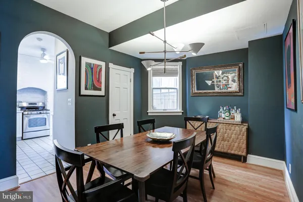 a view of a dining room with furniture and window