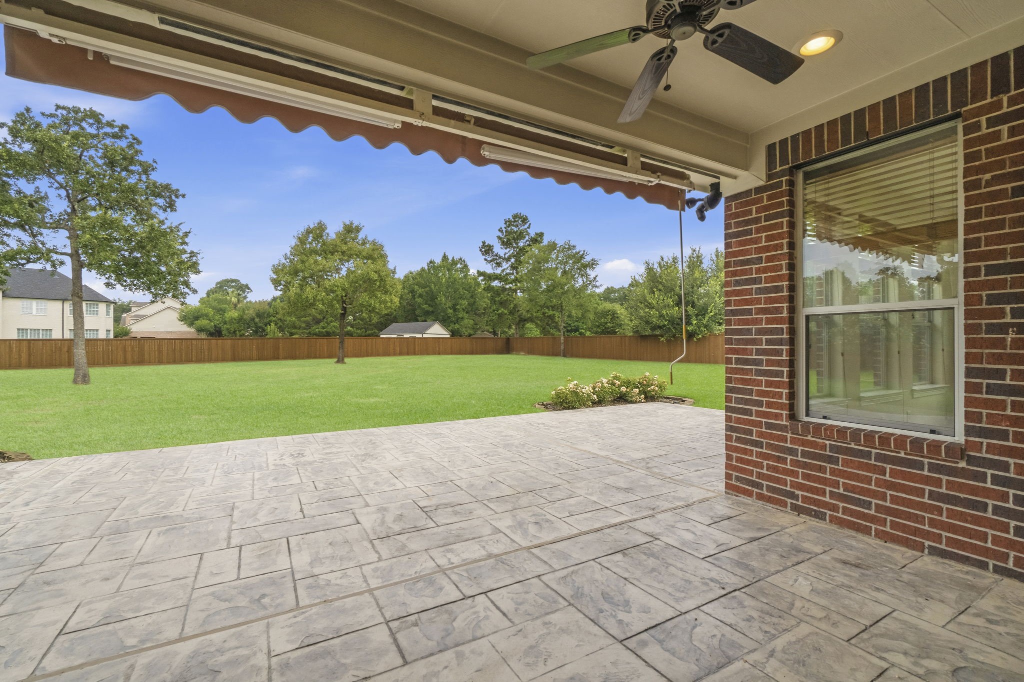 2716 Silverstone Way Conroe, TX 77304 - Photo 21 of 27 Outside, enjoy a new cedar privacy fence, dual drive gates, Rain Bird sprinkler system, drainage improvements, and updated landscaping.