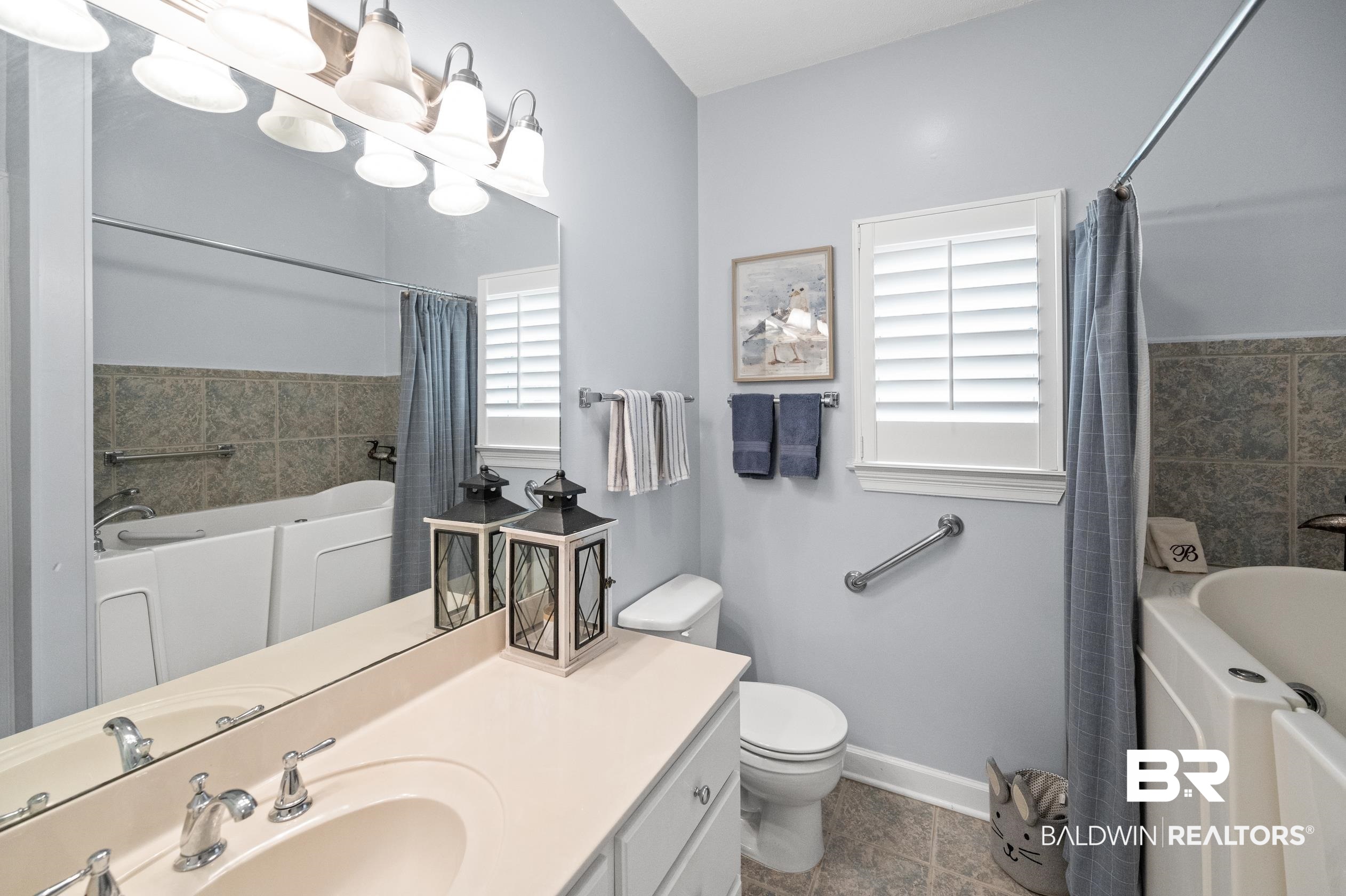 6638 Jackson Square Daphne, AL 36526 - Photo 27 of 62 Bathroom with vanity, toilet, tile patterned flooring, and a bathing tub