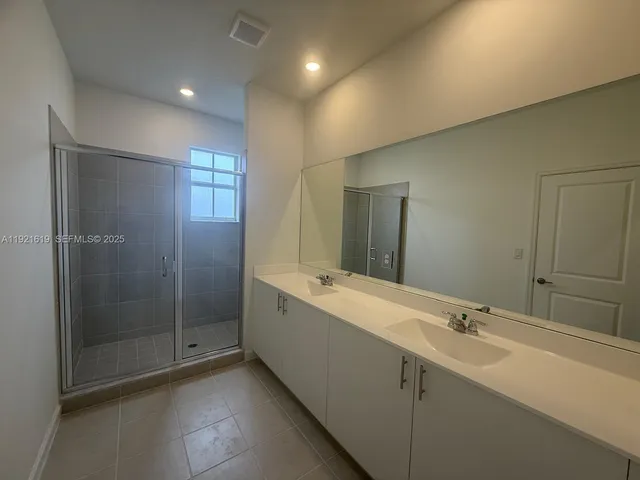a bathroom with a bathtub and a sink