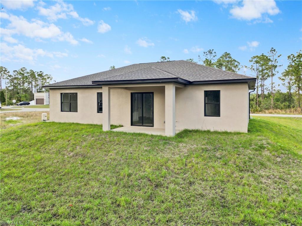 2717 20th Street West Lehigh Acres, FL 33971 - Photo 2 of 20 a house that has a yard