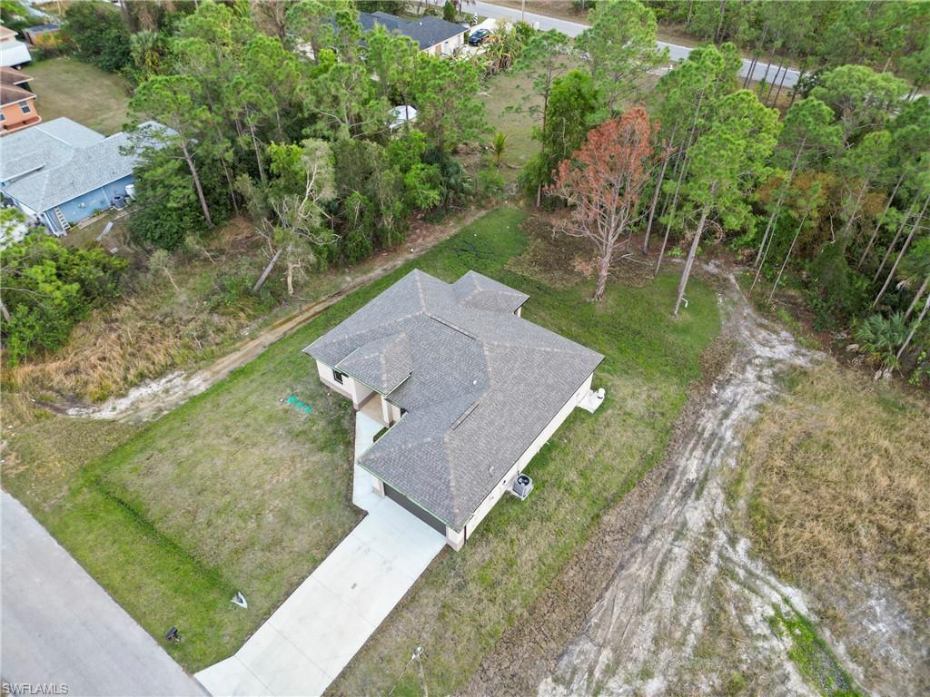 2717 20th Street West Lehigh Acres, FL 33971 - Photo 4 of 20 an aerial view of a house