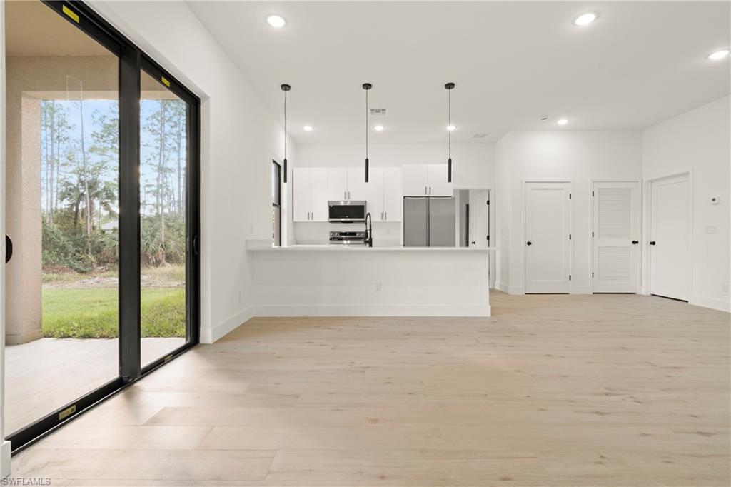 2717 20th Street West Lehigh Acres, FL 33971 - Photo 7 of 20 a view of a kitchen with large kitchen with a sink and cabinets