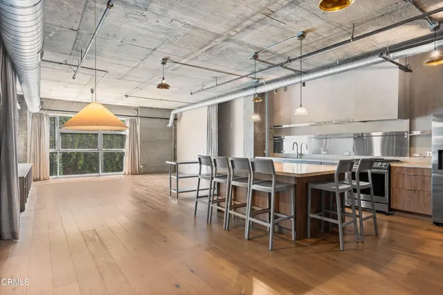 a view of a dining room with furniture window and outside view