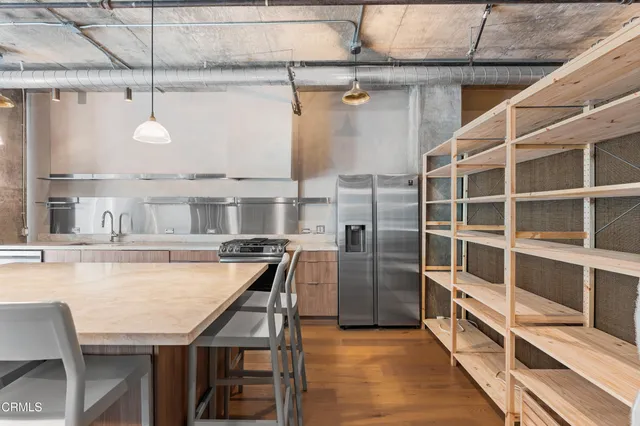 a kitchen with a table and chairs