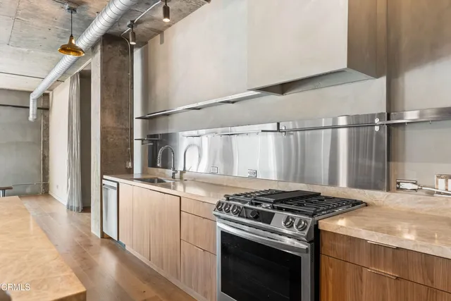 a kitchen with a stove and a sink