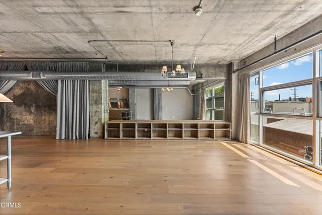 a view of a room with wooden roof and windows