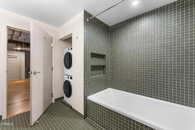 a bathroom with a bathtub and a shower