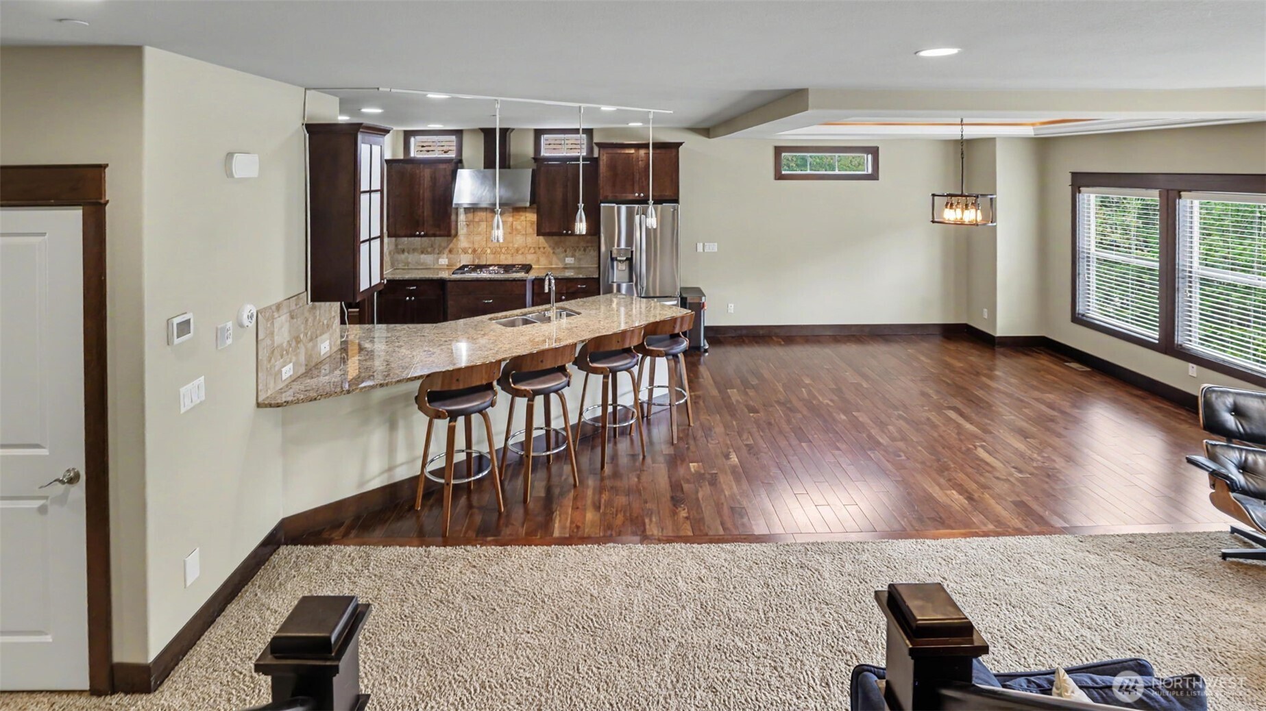 1357 Elma Place Northeast Renton, WA 98059 - Photo 29 of 40 a living room with furniture and wooden floor