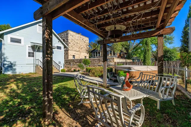 a view of a patio with chairs and wooden floor