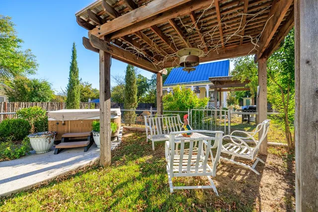 a living room with fireplace furniture and a wooden floor