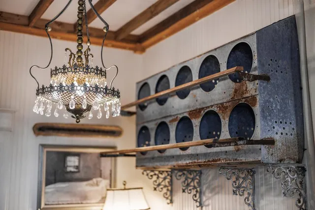 a bedroom with a large bed and a flat screen tv