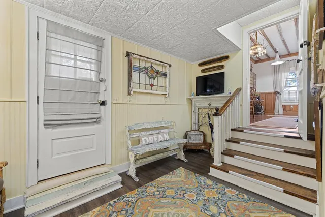 a bathroom with a sink vanity and a shower