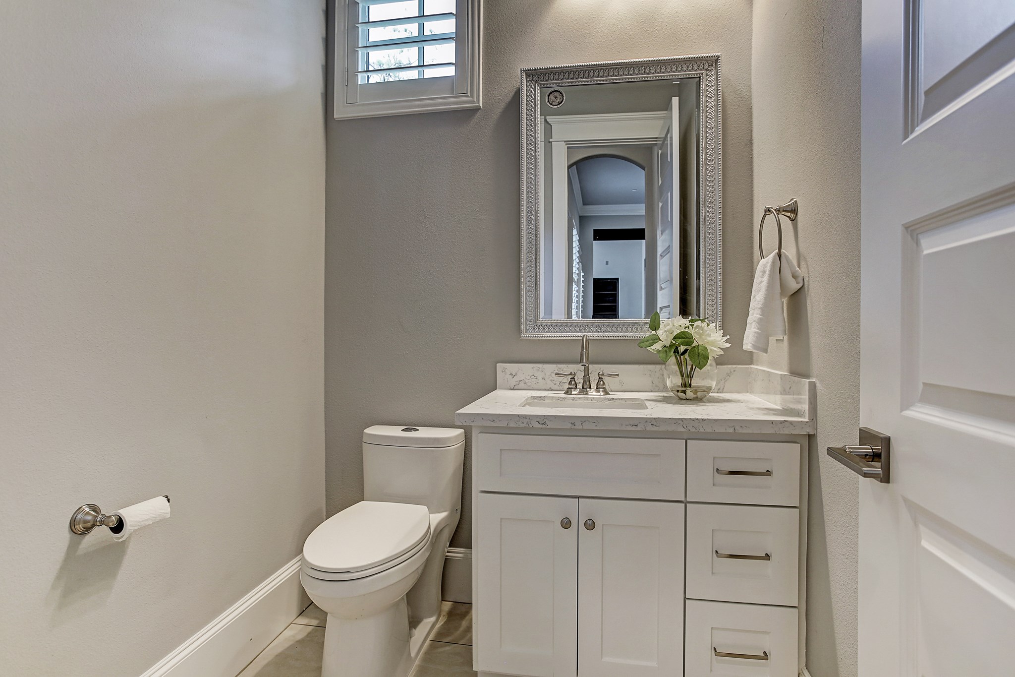 325 Bunker Hill Road Houston, TX 77024 - Photo 19 of 50 a bathroom with a toilet a sink a mirror and vanity