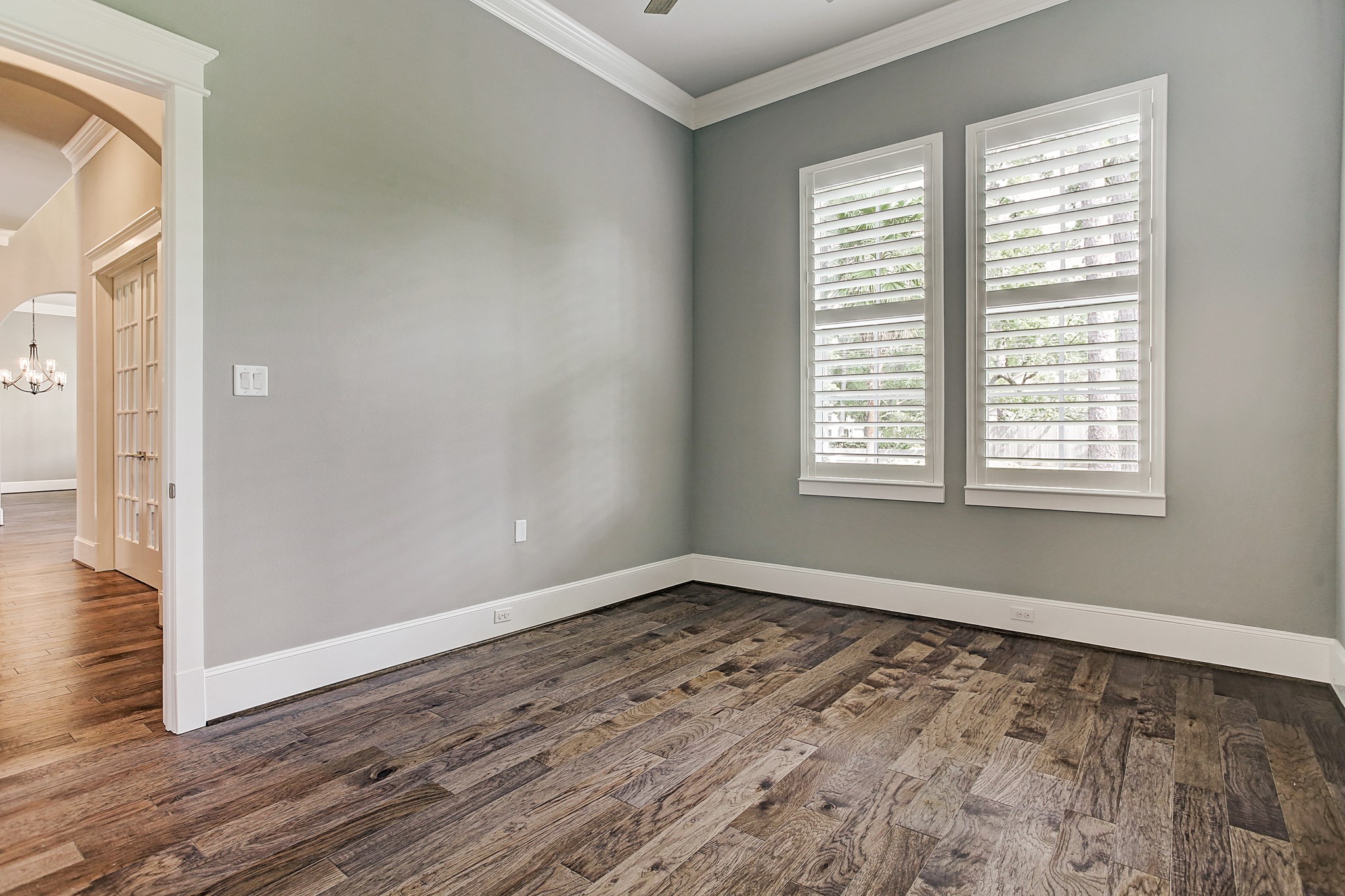 325 Bunker Hill Road Houston, TX 77024 - Photo 20 of 50 a view of an empty room with wooden floor and a window