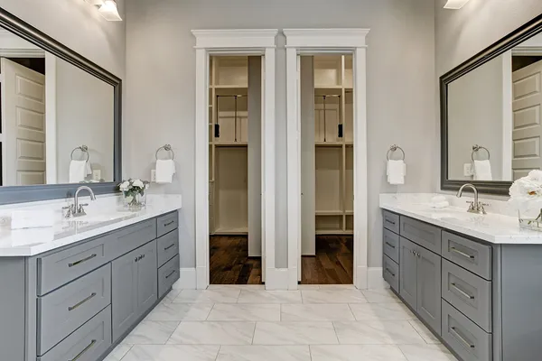 a spacious bathroom with a granite countertop sink and a mirror