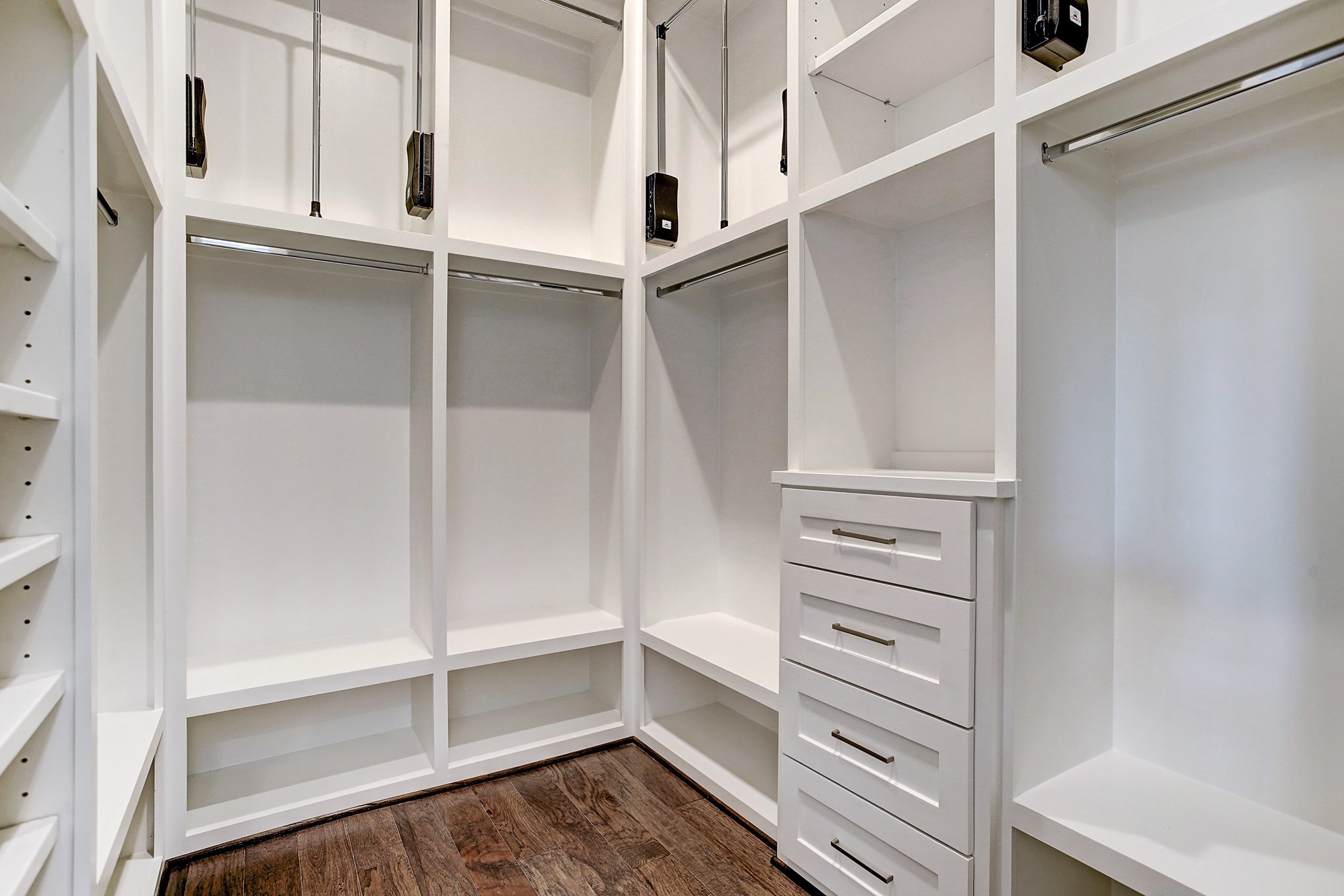 325 Bunker Hill Road Houston, TX 77024 - Photo 28 of 50 a view of walk in closet with empty racks