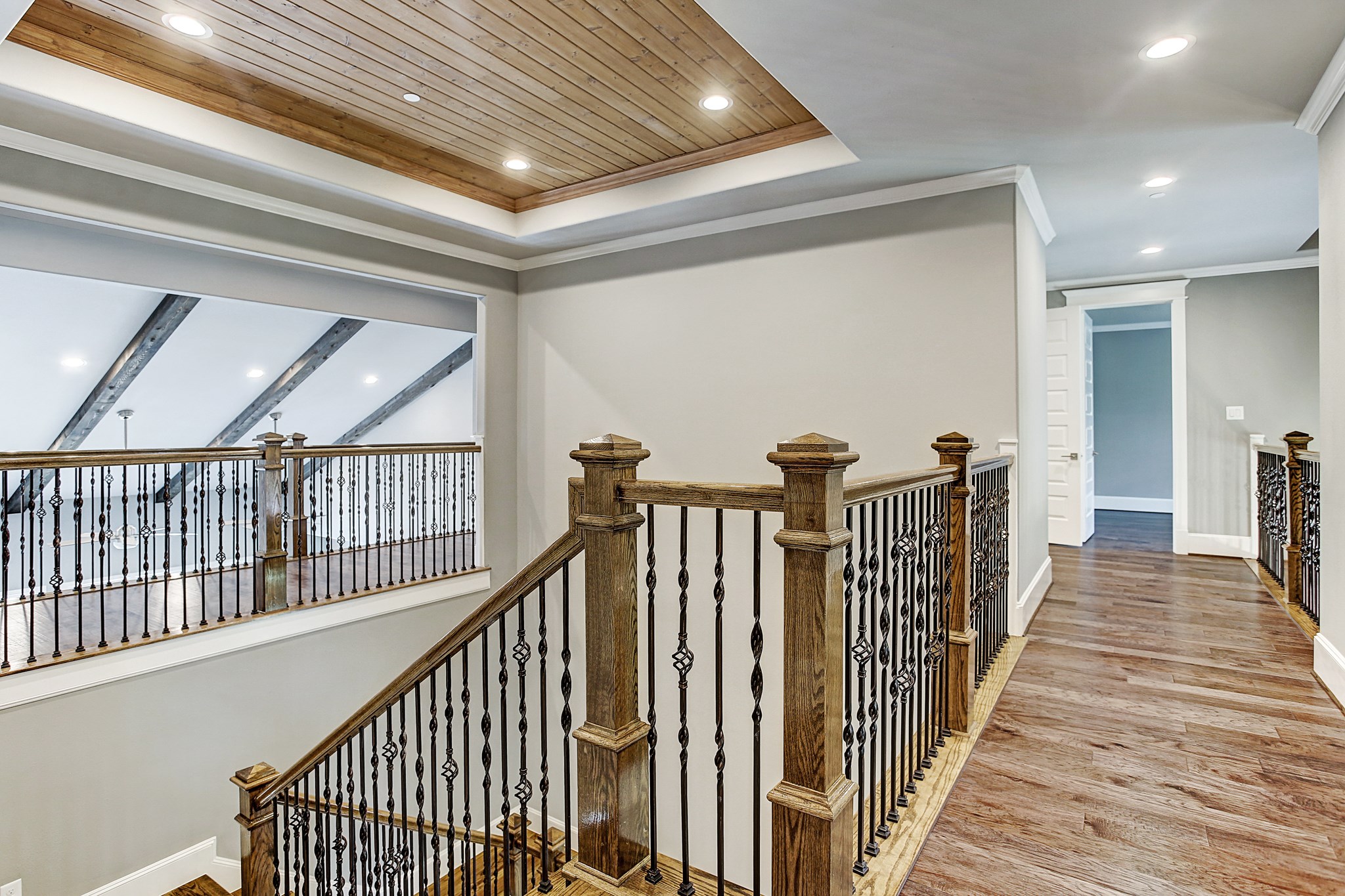 325 Bunker Hill Road Houston, TX 77024 - Photo 29 of 50 a view of a hallway with wooden floor and stairs