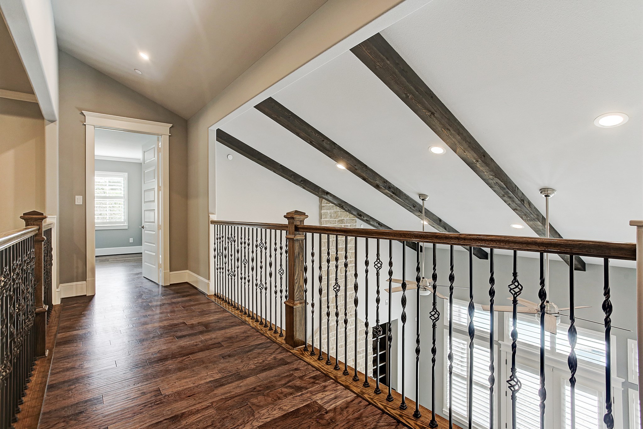 325 Bunker Hill Road Houston, TX 77024 - Photo 30 of 50 a view of a hallway with wooden floor and stairs