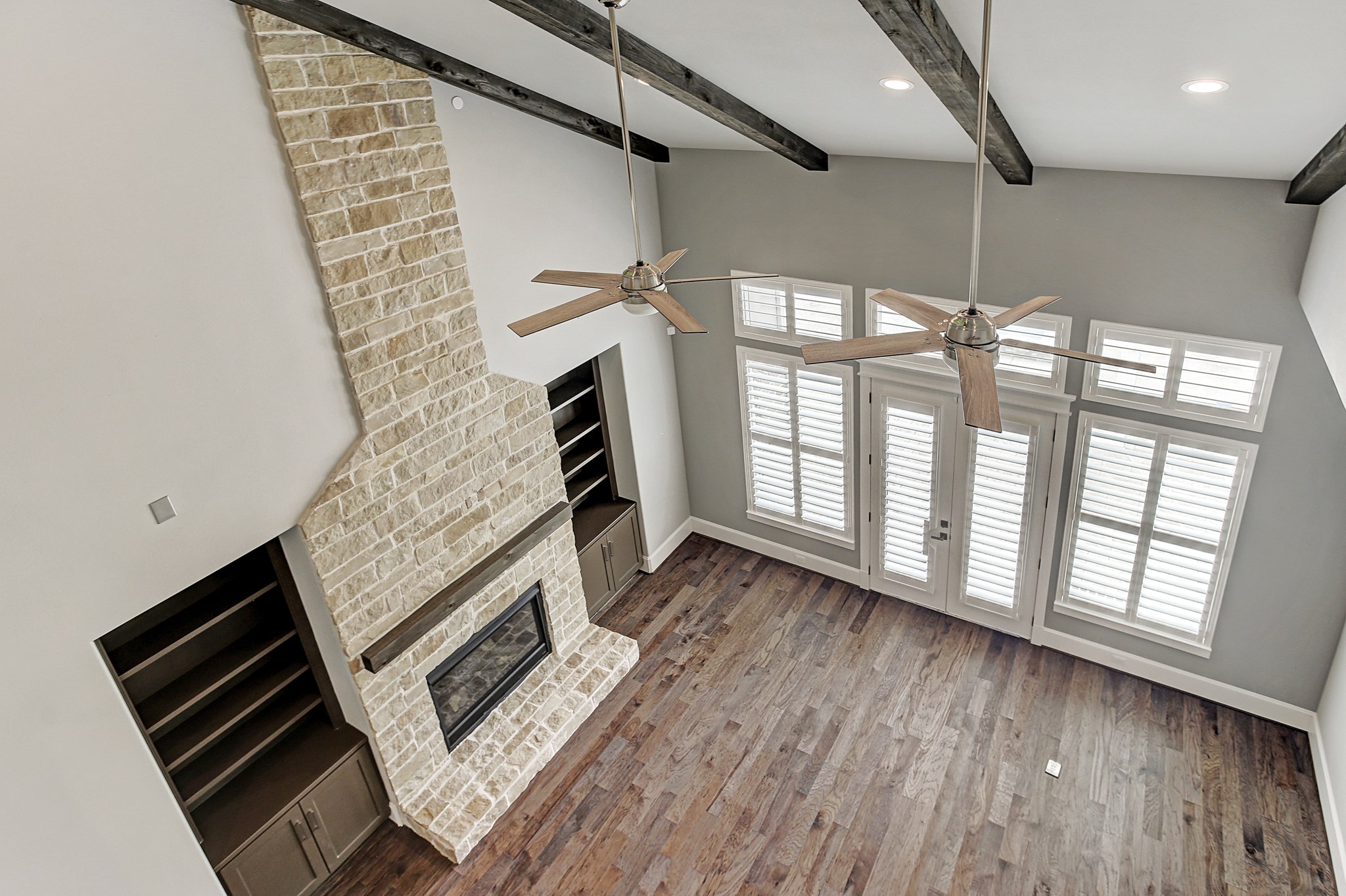 325 Bunker Hill Road Houston, TX 77024 - Photo 31 of 50 a view of an empty room with a fireplace and a window