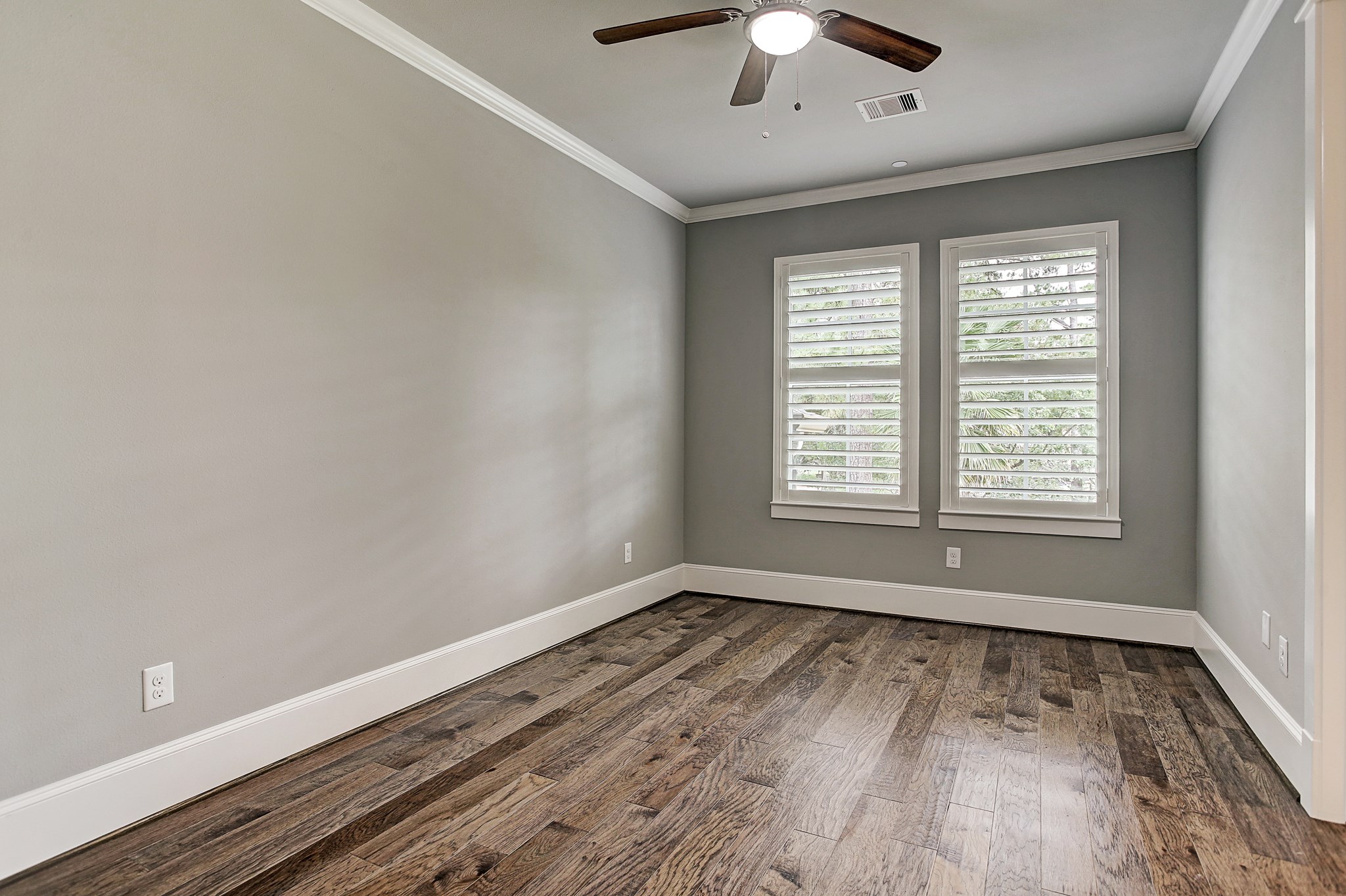 325 Bunker Hill Road Houston, TX 77024 - Photo 35 of 50 a view of an empty room with wooden floor and a window