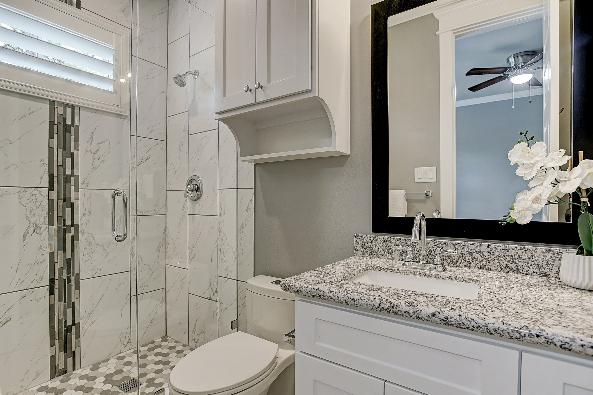 325 Bunker Hill Road Houston, TX 77024 - Photo 36 of 50 a bathroom with a granite countertop sink a toilet and shower