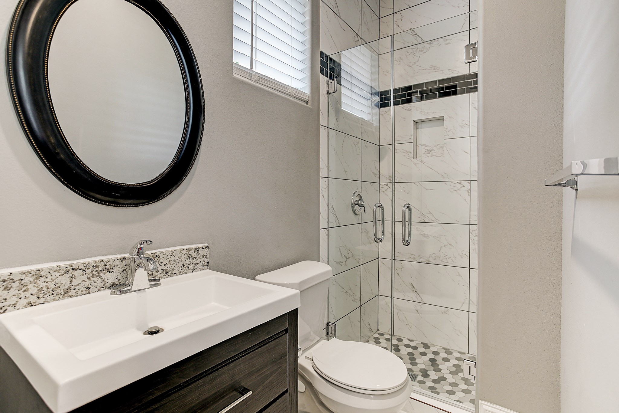 325 Bunker Hill Road Houston, TX 77024 - Photo 44 of 50 a bathroom with a sink a toilet and mirror