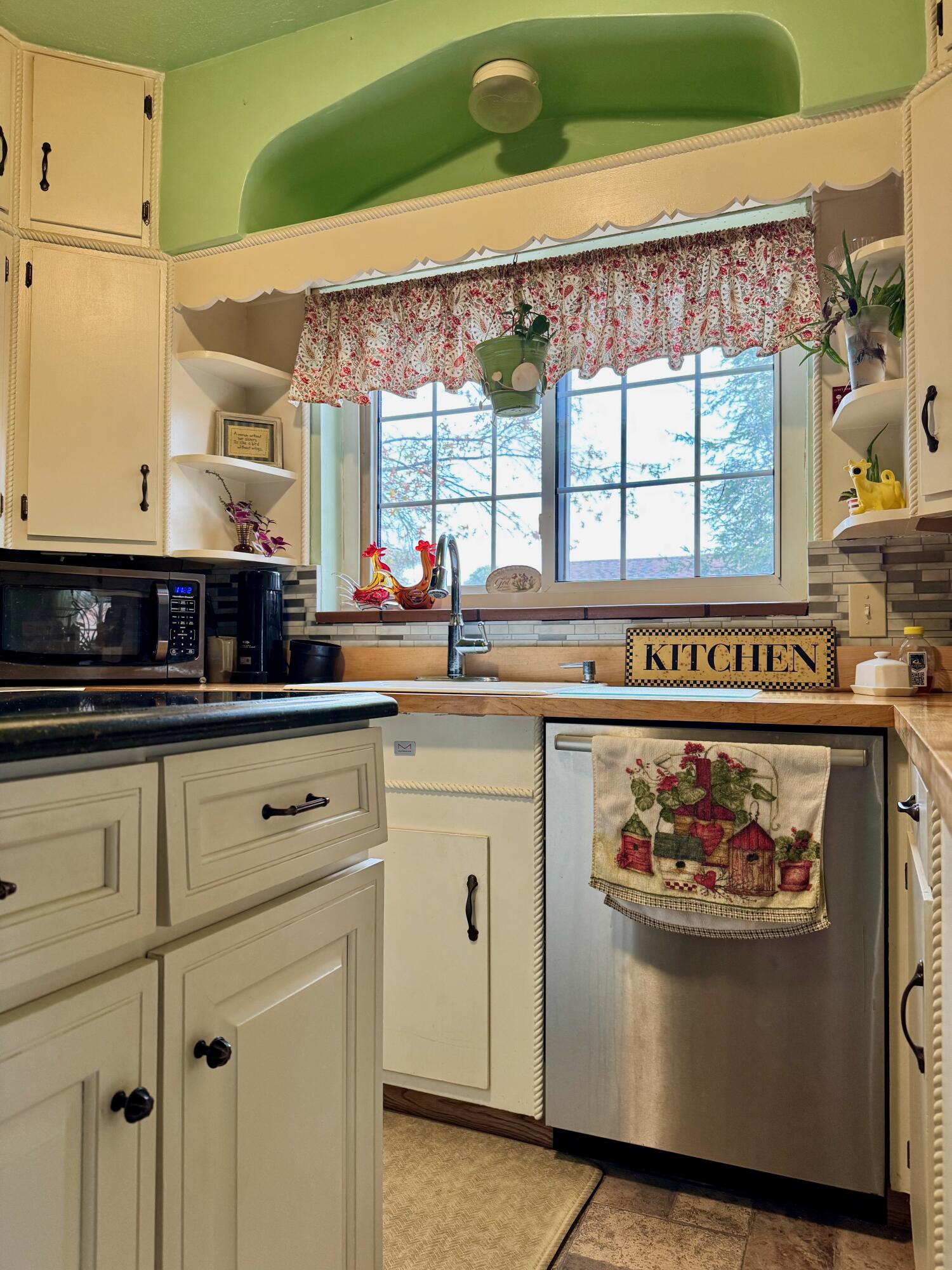 703 South Main Street Knox, IN 46534 - Photo 11 of 32 a kitchen with stainless steel appliances granite countertop a refrigerator and a stove