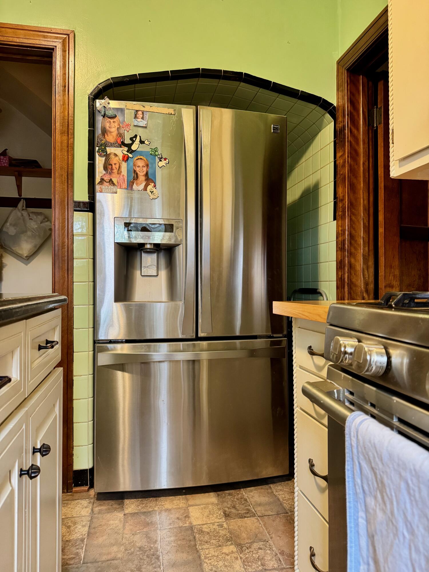 703 South Main Street Knox, IN 46534 - Photo 12 of 32 a kitchen with stainless steel appliances a refrigerator and a stove top oven