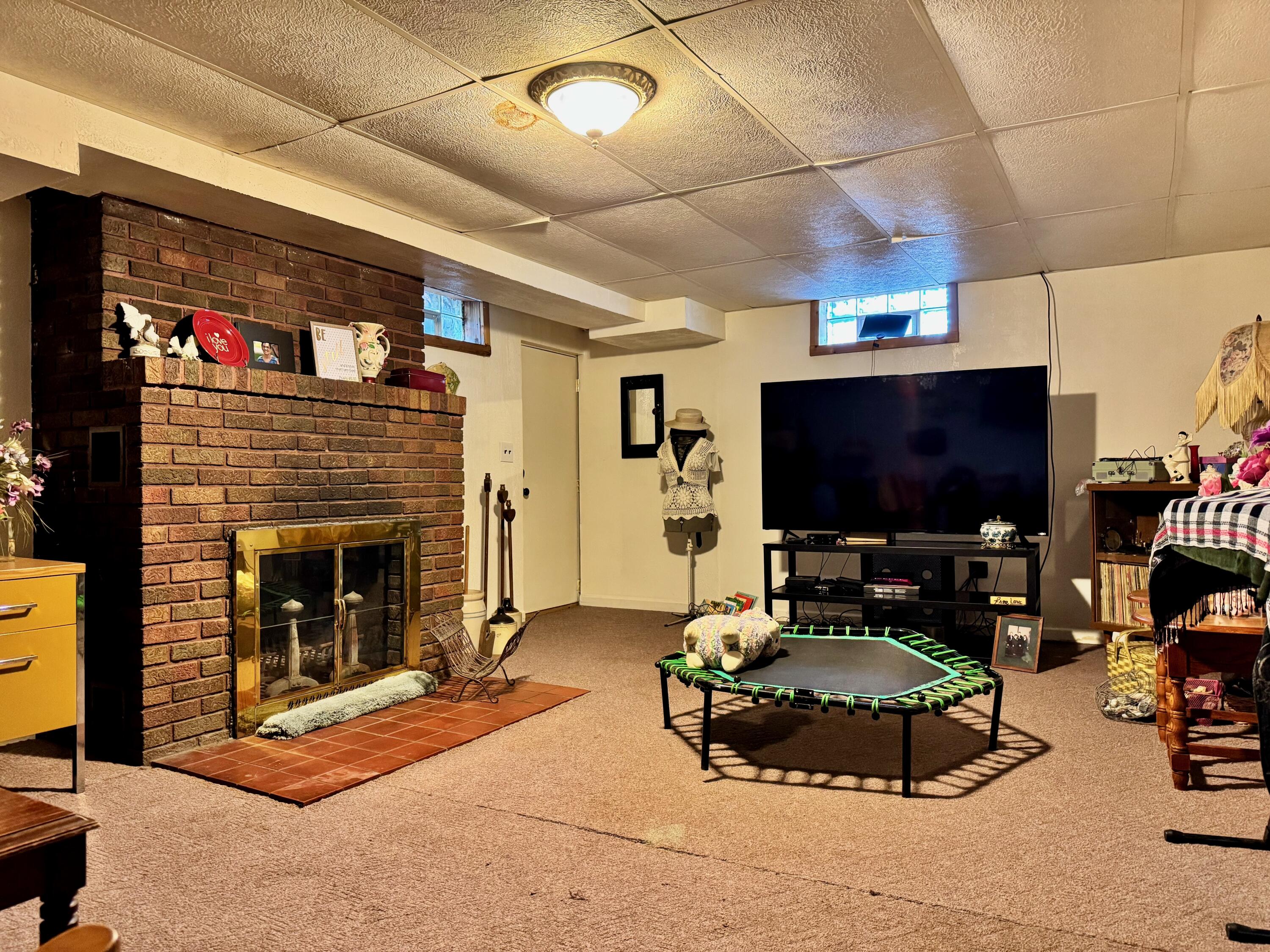 703 South Main Street Knox, IN 46534 - Photo 23 of 32 a living room with furniture and a flat screen tv