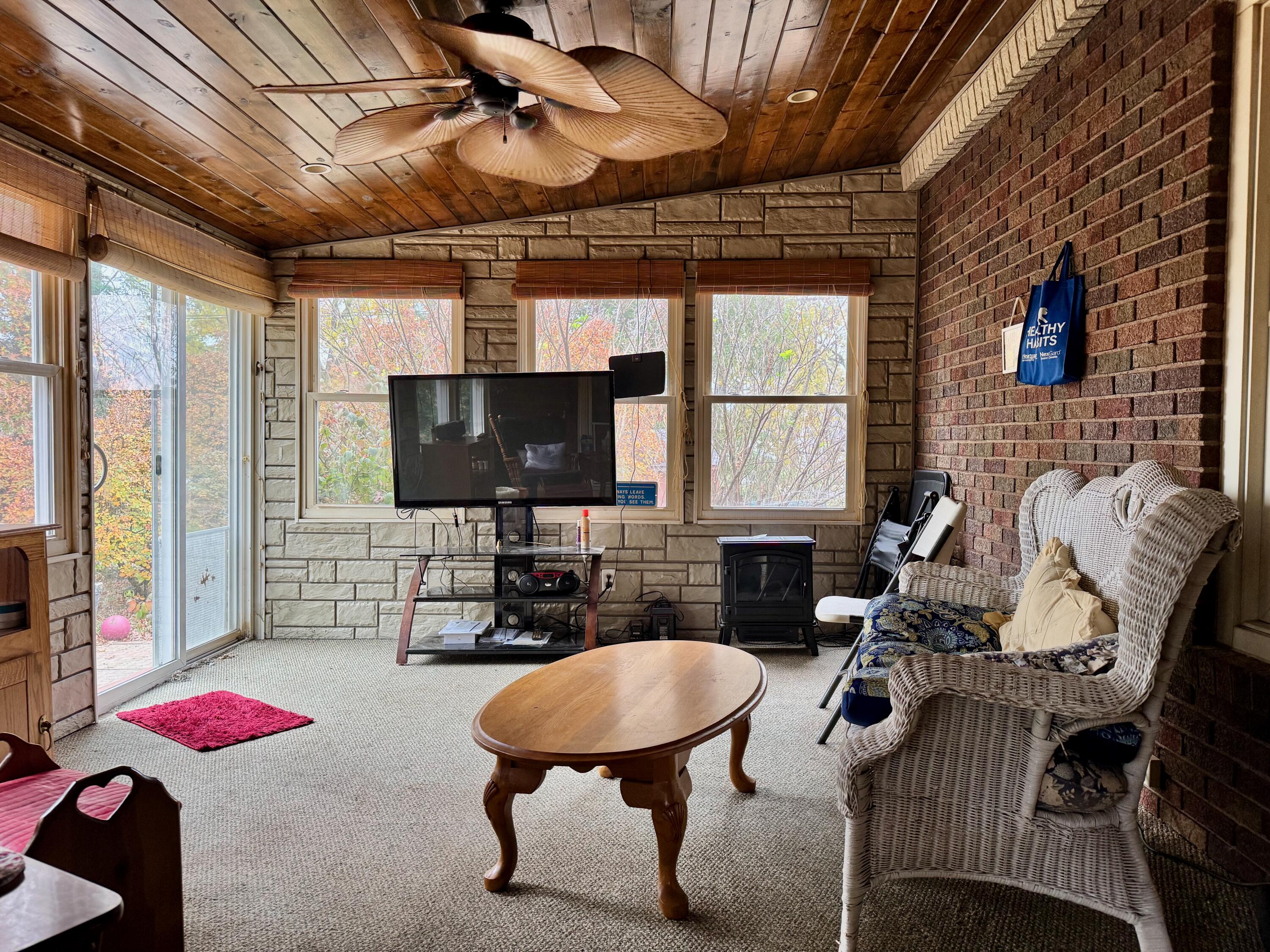 703 South Main Street Knox, IN 46534 - Photo 6 of 32 a living room with furniture and a flat screen tv