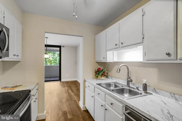a kitchen with a stove and a microwave