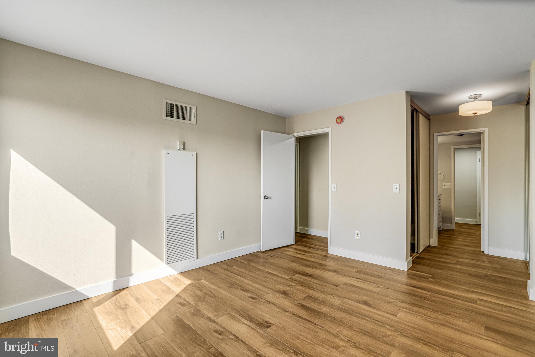 6101 Edsall Road, Unit 312 Alexandria, VA 22304 - Photo 25 of 57 a view of a livingroom with wooden floor and closet