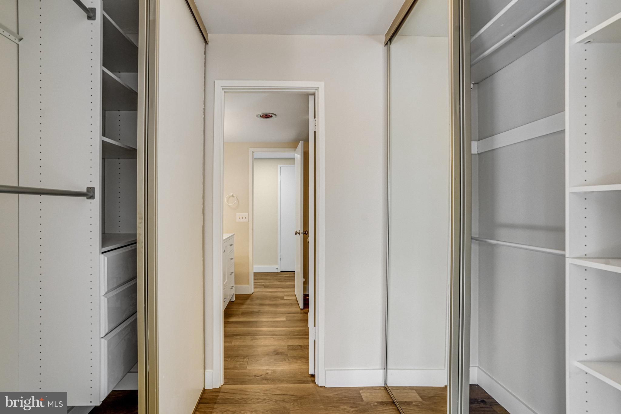 6101 Edsall Road, Unit 312 Alexandria, VA 22304 - Photo 26 of 57 a view of a hallway with wooden floor and staircase